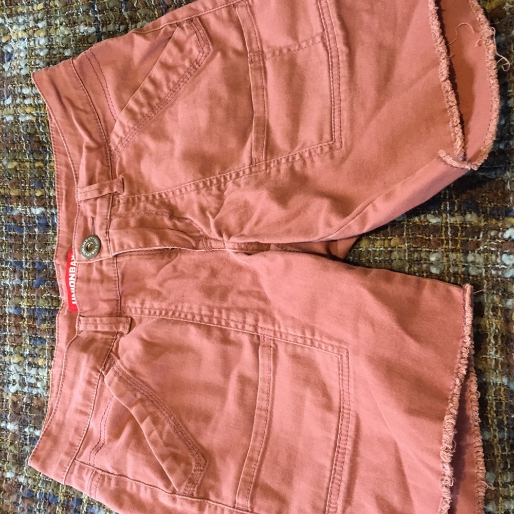 coral shorts with rips